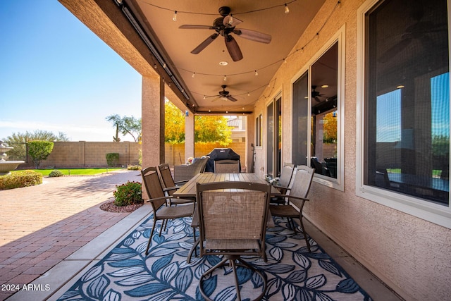 view of patio featuring ceiling fan