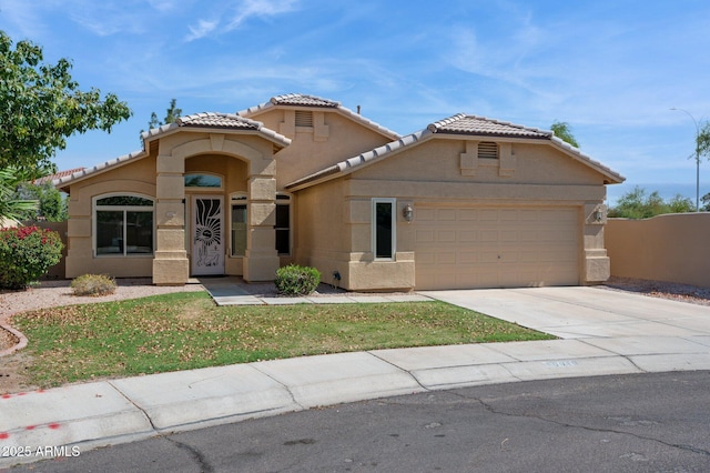 5010 W Ivanhoe St, Chandler, AZ 85226 - mediterranean / spanish-style house featuring stucco siding, a tiled roof, an attached garage, and driveway
