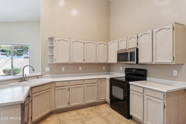 5010 W Ivanhoe St, Chandler, AZ 85226 - kitchen with appliances with stainless steel finishes, a sink, light tile patterned floors, light countertops, and light brown cabinetry