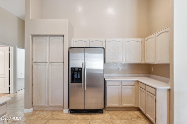 5010 W Ivanhoe St, Chandler, AZ 85226 - kitchen with stainless steel fridge, light countertops, a high ceiling, light tile patterned floors, and light brown cabinetry