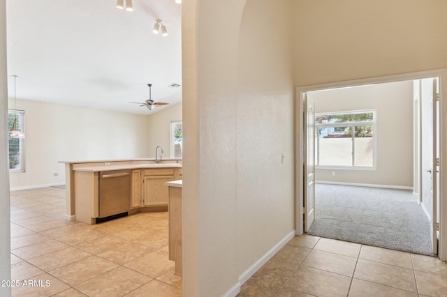 5010 W Ivanhoe St, Chandler, AZ 85226 - hallway with light tile patterned flooring, a sink, baseboards, arched walkways, and a high ceiling