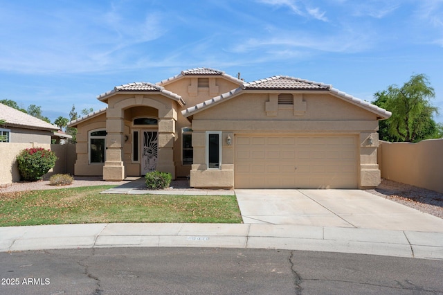 5010 W Ivanhoe St, Chandler, AZ 85226 - mediterranean / spanish house featuring stucco siding, concrete driveway, a garage, and fence