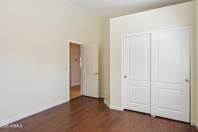 5010 W Ivanhoe St, Chandler, AZ 85226 - unfurnished bedroom with dark wood-style floors, a closet, baseboards, and a high ceiling