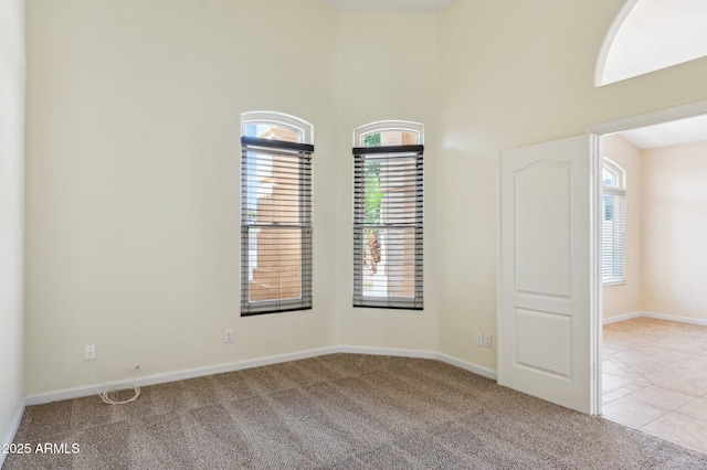 5010 W Ivanhoe St, Chandler, AZ 85226 - spare room featuring carpet flooring, a high ceiling, and baseboards