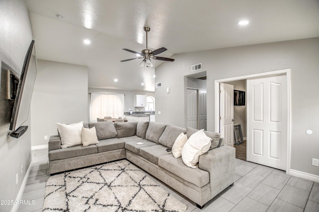 12543 W Roanoke Ave, Avondale, AZ 85392 - living area with lofted ceiling, recessed lighting, baseboards, visible vents, and ceiling fan