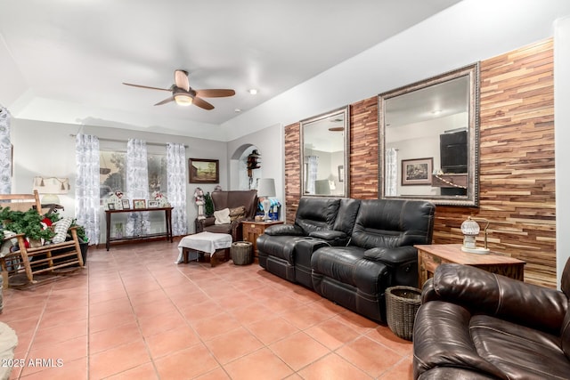 living room featuring ceiling fan and light tile patterned floors