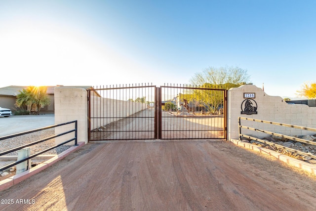 view of gate featuring fence