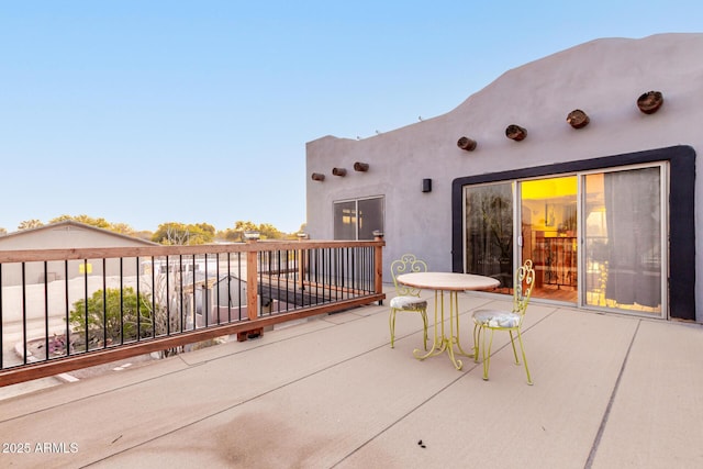 view of patio featuring a balcony