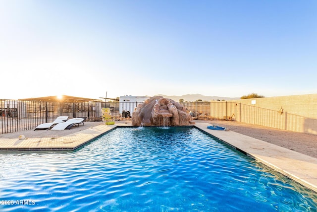 view of swimming pool featuring a fenced in pool, a patio area, and fence