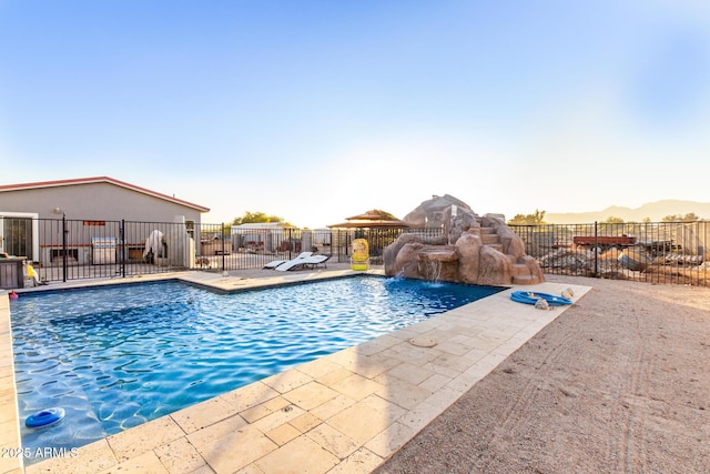 view of pool with a patio area, fence, and a fenced in pool