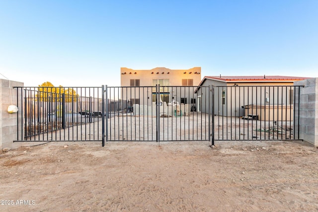 view of gate with fence