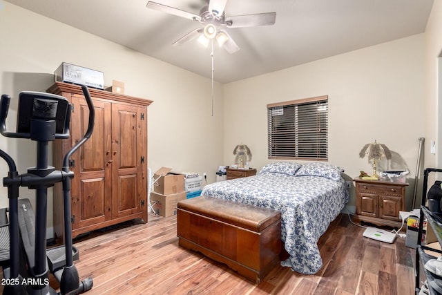 bedroom with light wood finished floors and ceiling fan