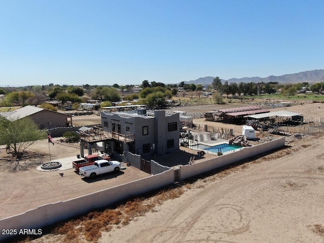 birds eye view of property with a mountain view