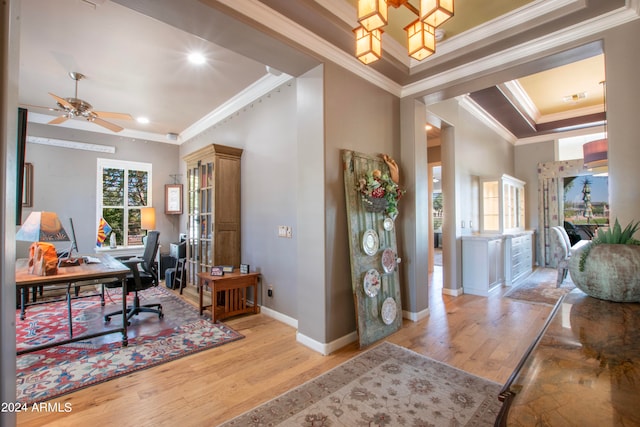 home office featuring ornamental molding, light hardwood / wood-style flooring, and ceiling fan