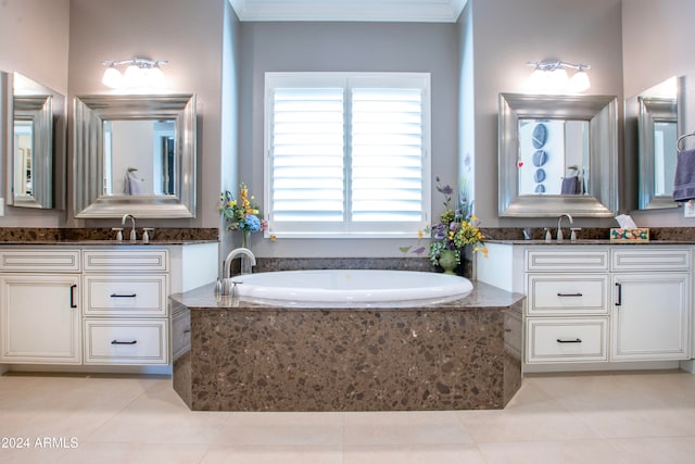 bathroom featuring vanity, a relaxing tiled tub, ornamental molding, and tile patterned flooring