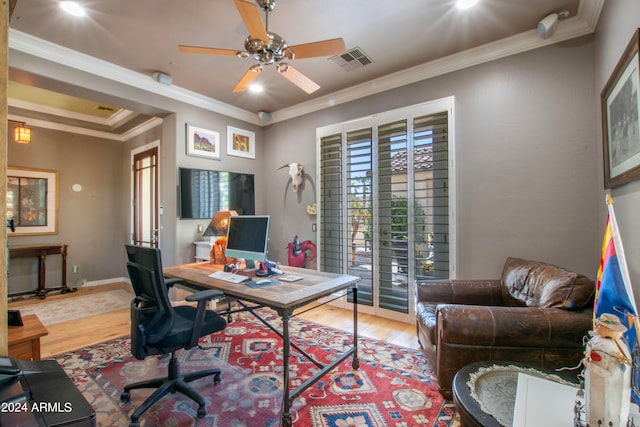 office space featuring ornamental molding, wood-type flooring, and ceiling fan