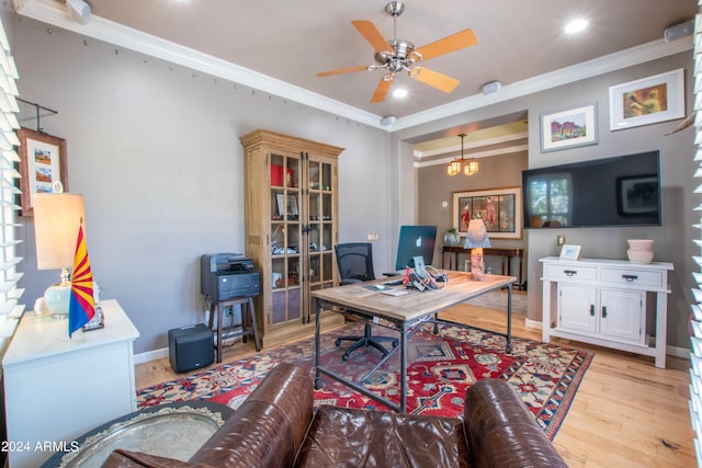 office space featuring ceiling fan, ornamental molding, and light hardwood / wood-style flooring