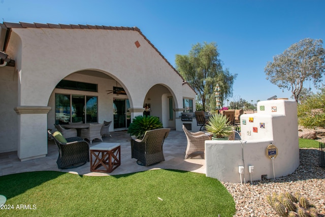 view of patio / terrace featuring ceiling fan