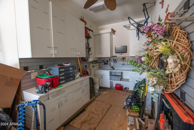 kitchen featuring white cabinetry and ceiling fan