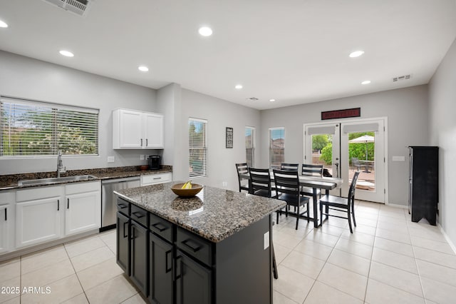 4466 S Brice, Mesa, AZ 85212 - kitchen featuring a sink, stainless steel dishwasher, white cabinetry, dark stone counters, and light tile patterned floors