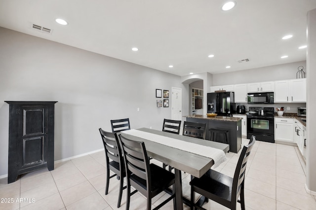 4466 S Brice, Mesa, AZ 85212 - dining area with arched walkways, light tile patterned floors, recessed lighting, and baseboards