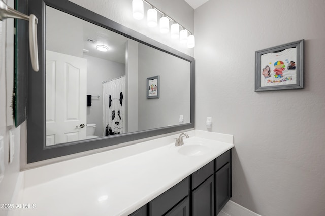4466 S Brice, Mesa, AZ 85212 - bathroom featuring vanity, toilet, baseboards, and a textured wall