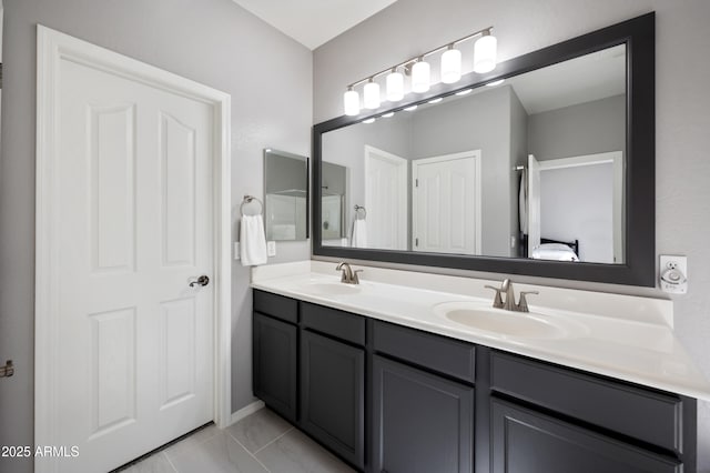 4466 S Brice, Mesa, AZ 85212 - bathroom with double vanity, connected bathroom, and marble look tiles
