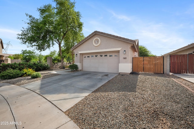 4466 S Brice, Mesa, AZ 85212 - view of front of house with a gate, stucco siding, driveway, fence, and an attached garage