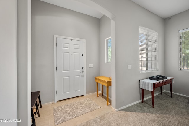 4466 S Brice, Mesa, AZ 85212 - entryway with healthy amount of natural light, arched walkways, light tile patterned floors, and baseboards