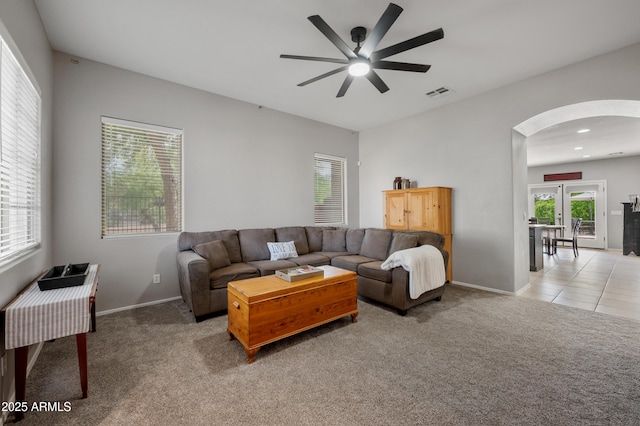 4466 S Brice, Mesa, AZ 85212 - living room with arched walkways, a ceiling fan, light carpet, and french doors