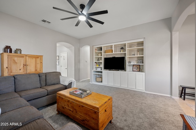 4466 S Brice, Mesa, AZ 85212 - carpeted living room with arched walkways, a ceiling fan, and baseboards