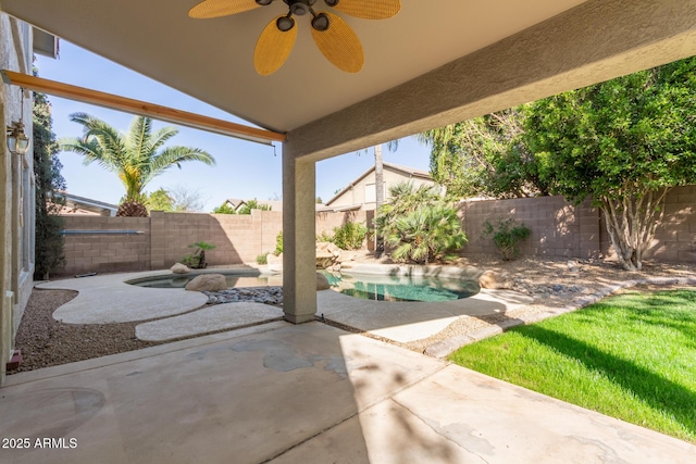 view of patio / terrace with a fenced backyard and a ceiling fan