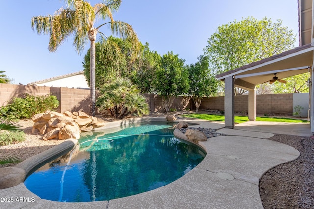 view of pool with a patio area, a fenced backyard, ceiling fan, and a fenced in pool