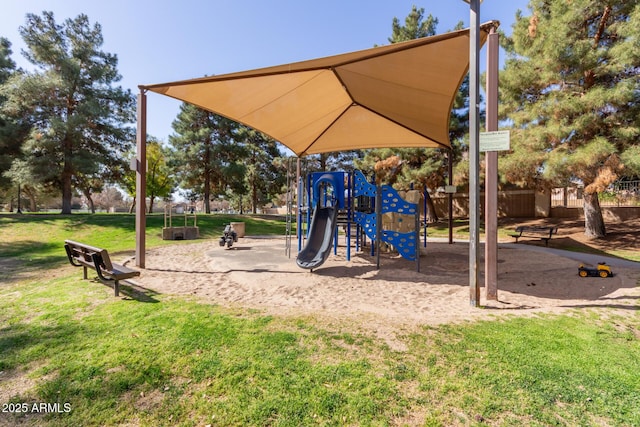 communal playground featuring a yard