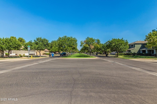 view of road with sidewalks and a residential view