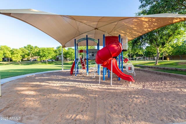 community jungle gym with a yard