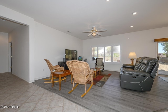 living room with a wealth of natural light and ceiling fan