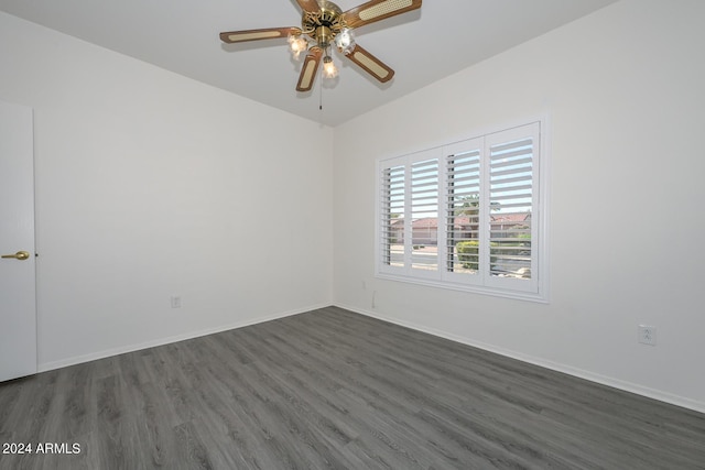 unfurnished room with ceiling fan and dark hardwood / wood-style floors