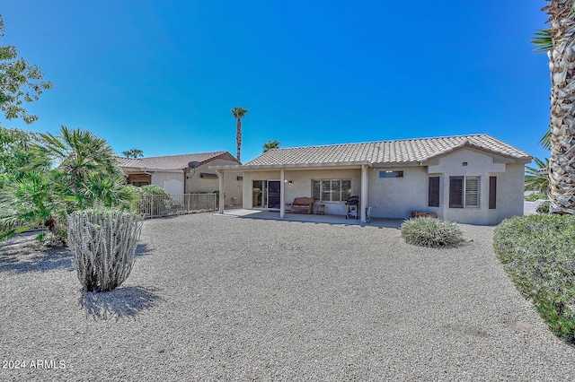 rear view of property with a patio area