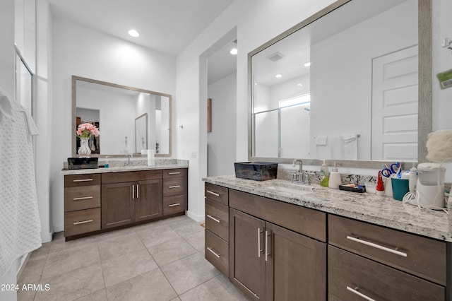 bathroom featuring tile patterned floors, vanity, and a shower with shower curtain