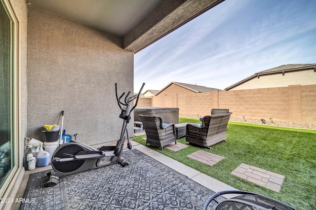 view of patio / terrace with a hot tub