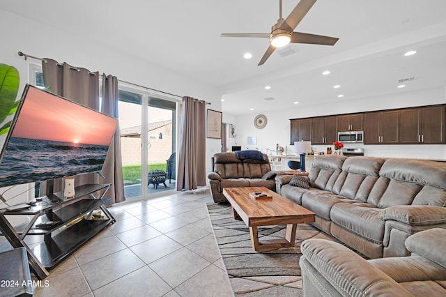 tiled living room featuring ceiling fan