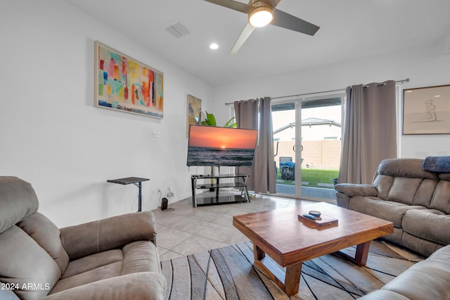 living room with ceiling fan and light tile patterned floors