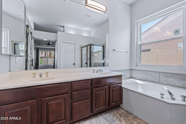 7911 E Posada Ave, Mesa, AZ 85212 - bathroom featuring a shower stall, a garden tub, double vanity, and plenty of natural light