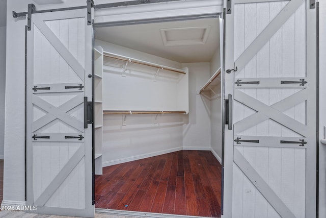 7911 E Posada Ave, Mesa, AZ 85212 - spacious closet with hardwood / wood-style flooring and a barn door