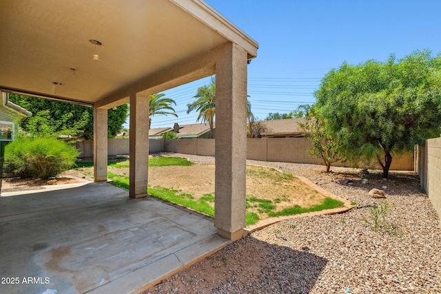 7911 E Posada Ave, Mesa, AZ 85212 - fenced backyard featuring a patio area