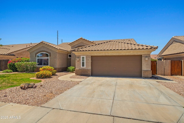 7911 E Posada Ave, Mesa, AZ 85212 - view of front of house with a tile roof, driveway, a garage, and stucco siding
