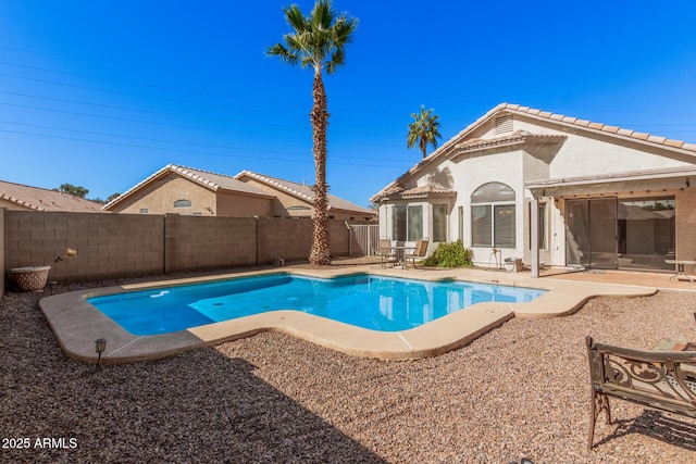 view of swimming pool with a patio area