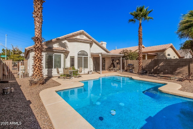 view of swimming pool with a patio