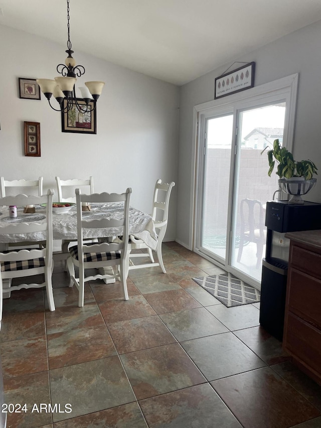 dining space featuring an inviting chandelier